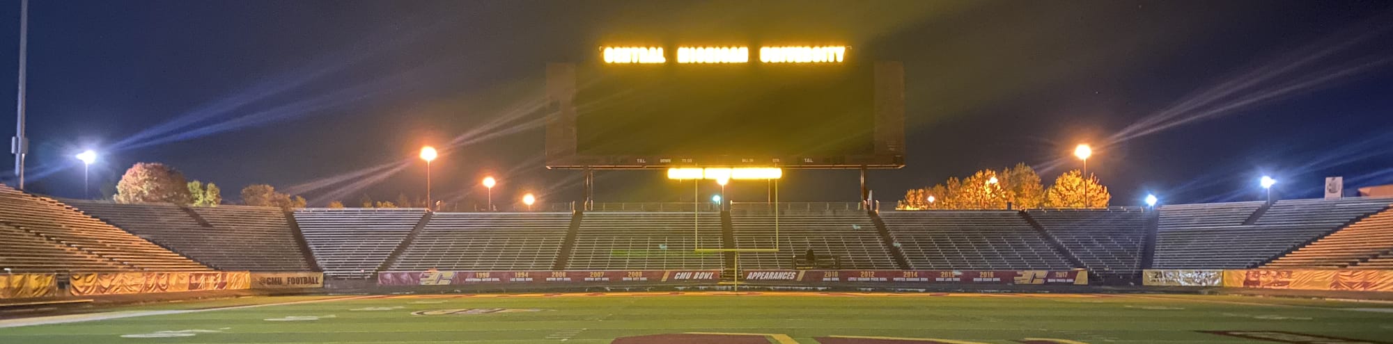 empty football stadium at night under the lights Chicago