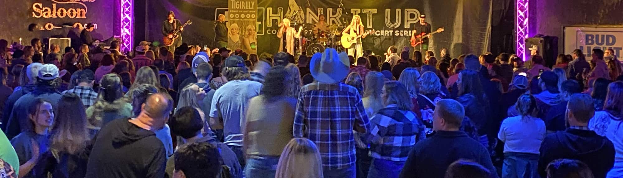 country concert with fans wearing cowboy hats Chicago